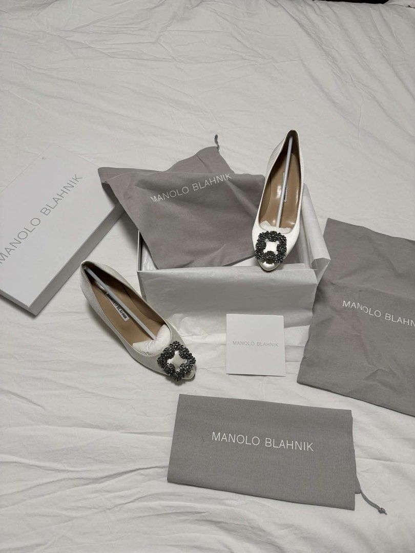 Manolo Blahnik Hangisi 50 White Pumps (Category: Heels) located in Valenzuela. Submitted by weewowa (Listing ID 1439134643, Image 2). Description: Manolo Blahnik Hangisi 50 White Satin Jewel Buckle Pumps Brand new with box and 100% authentic, with receipt 💯 👡 Size 6.5 - 50mm heel height Bought from US for $1,450 (₱87,000) Selling for ₱55,000 only Price is slightly negotiable..