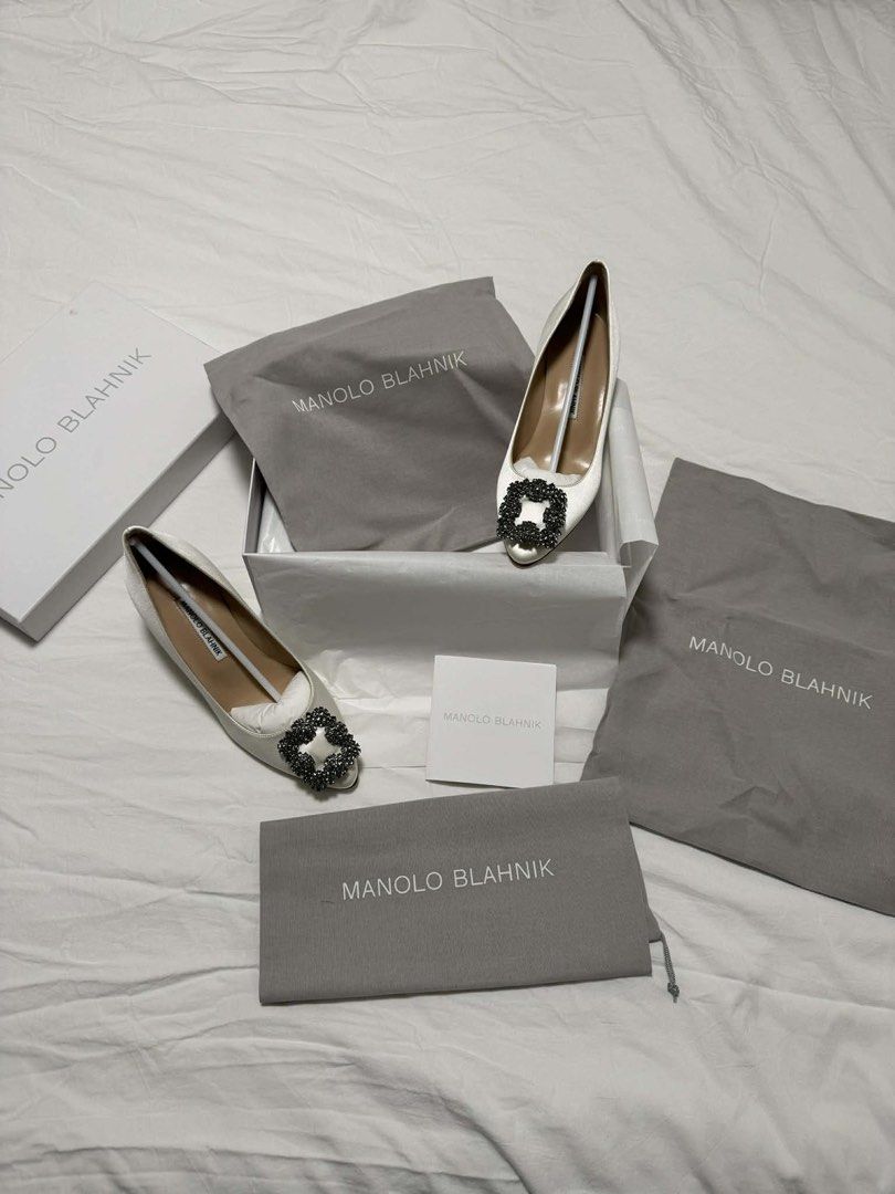Manolo Blahnik Hangisi 50 White Pumps (Category: Heels) located in Valenzuela. Submitted by weewowa (Listing ID 1439134643, Image 1). Description: Manolo Blahnik Hangisi 50 White Satin Jewel Buckle Pumps Brand new with box and 100% authentic, with receipt 💯 👡 Size 6.5 - 50mm heel height Bought from US for $1,450 (₱87,000) Selling for ₱55,000 only Price is slightly negotiable..