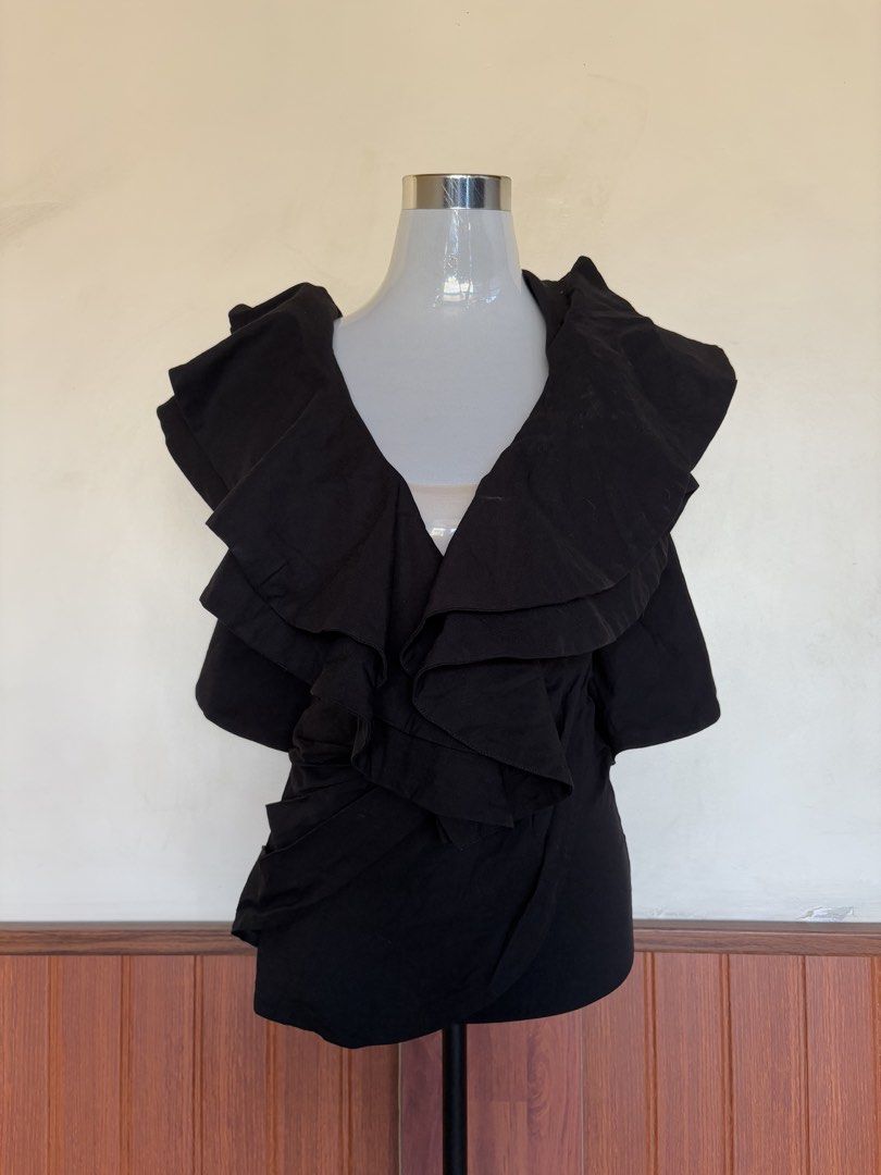 Michael Costello x Revolve Black Ruffled Mini Dress (Category: Dresses) located in Cebu City. Submitted by stylingtrends.coll (Listing ID 1439146137, Image 3). Description: - Authentic Michael Costello x Revolve black mini dress - Dramatic ruffle detailing on shoulders - Plunging neckline - Low back - Fitted silhouette - Heavy and thick fabric Size: Small.