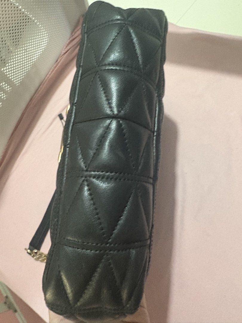 Authentic mk bag (Category: Luxury Bags & Wallets) located in Quezon City. Submitted by preetycindz (Listing ID 1439116497, Image 3). Description: 100% authentic - Michael Kors black quilted shoulder bag - Gold chain strap - Gold hardware - Interior: zippered pocket, logo lining - Flap closure with gold clasp still in good condition money back if proven fake .