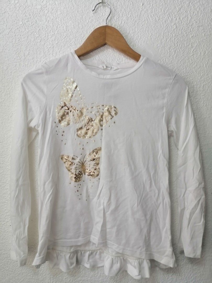 MNG Butterfly Long Sleeve Top (Category: Babies & Kids Fashion) located in Baguio. Submitted by zealfish-f7c3 (Listing ID 1439077074, Image 1). Description: - MNG white long-sleeved top - Butterfly design - Ruffled hem - Crew neck - Gold sequin embellishments - Size: 152cm (fits 12 years old) - Made in China.
