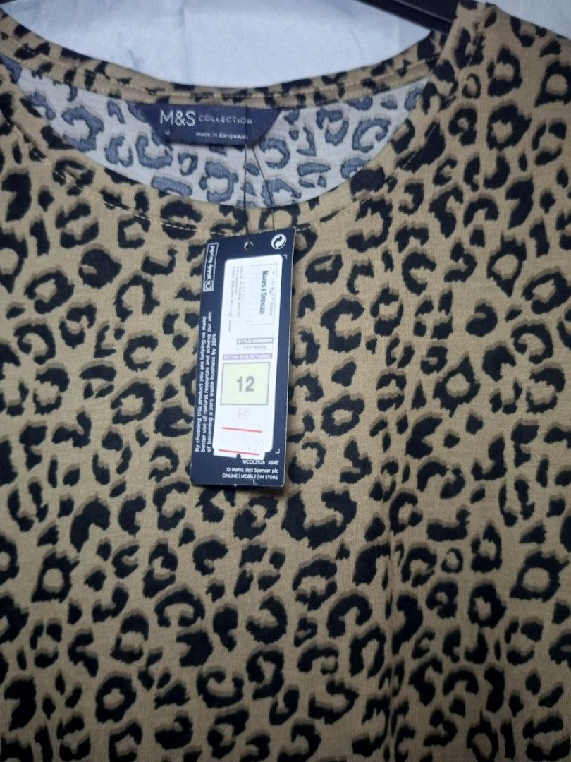 M&S Leopard Print T-shirt Size 12 (Category: Tshirts & Polo Shirts ) located in Quezon City. Submitted by czyrainkaye (Listing ID 1439180889, Image 2). Description: - M&S Leopard Print T-shirt - Size: 12 - Features a classic leopard print - Round neckline - Short sleeves - Made of soft material - Versatile for various outfits.