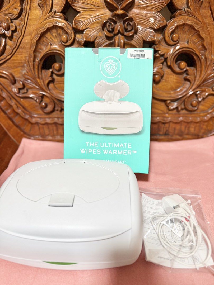 Munchkin The Ultimate Wipes Warmer (Category: Diapers & Baby Wipes) located in Quezon City. Submitted by obsessedwithbagsbymsjpq (Listing ID 1439104082, Image 1). Description: - Munchkin Ultimate Wipes Warmer - Includes: Warmer, original box, and power adapter - Color: White with green accent - Designed to keep baby wipes warm - Provides comfortable use for your baby.