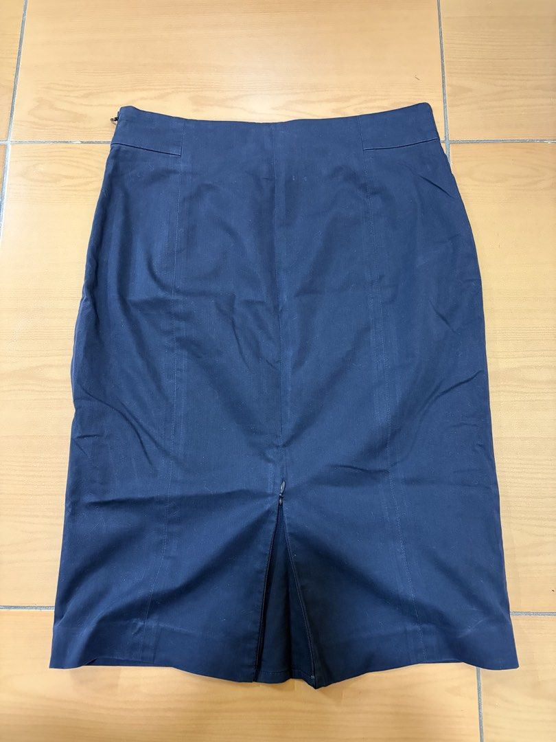 Navy Blue Pencil Skirt (Category: Skirts) located in Quezon City. Submitted by bchewyt (Listing ID 1439099606, Image 3). Description: - Classic navy blue pencil skirt - Features a back zipper closure - Includes a slit at the back for movement - Tailored fit - Ideal for office or formal wear.