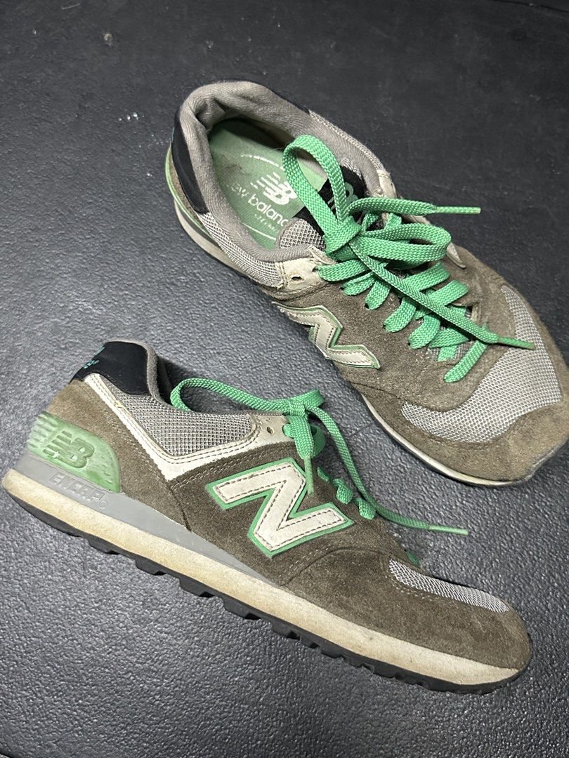 New Balance 574 Sneakers (Category: Sneakers) located in Quezon City. Submitted by plzdeclutter (Listing ID 1439218292, Image 1). Description: - New Balance 574 sneakers - Brown and green color scheme - Iconic 'N' logo on the sides - Suede and mesh upper - Green laces - 'New Balance' logo on heel and tongue - No issue -sign of wear -Size 5.