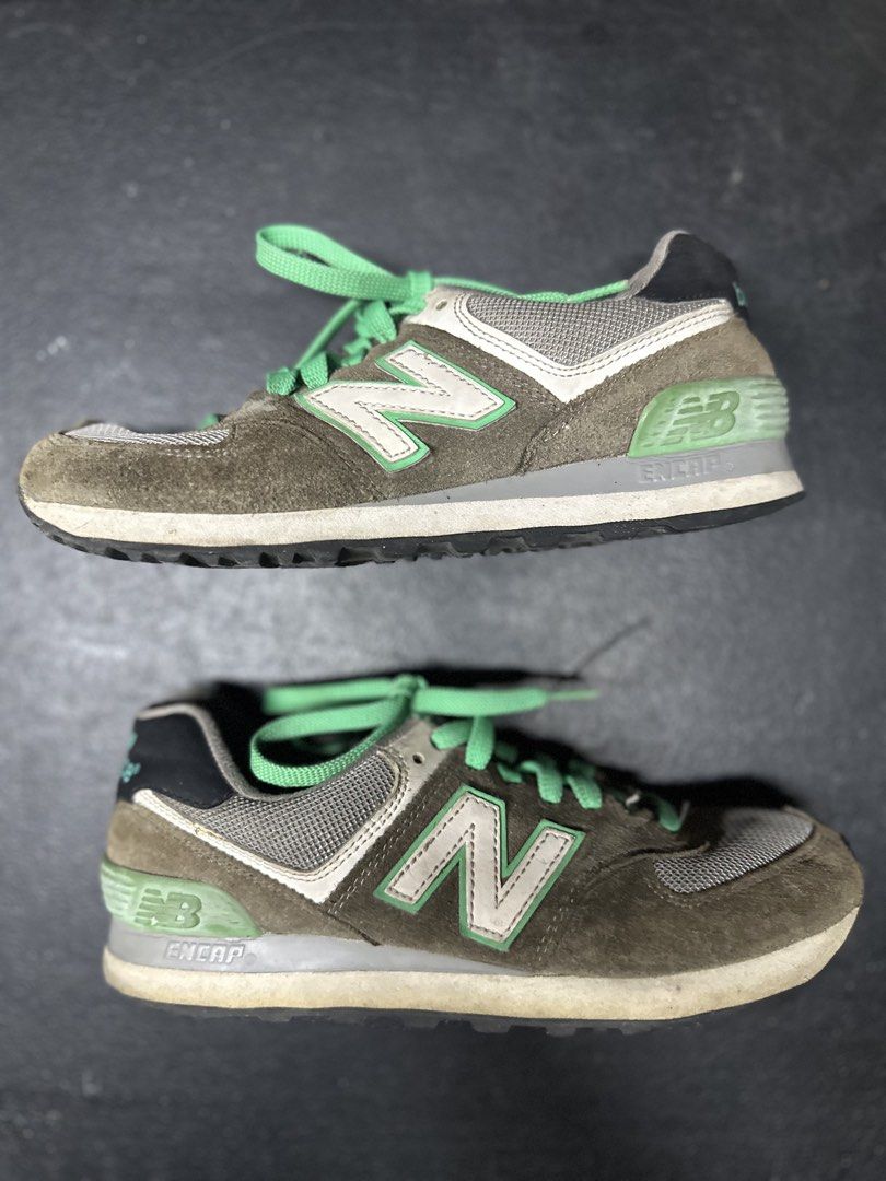 New Balance 574 Sneakers (Category: Sneakers) located in Quezon City. Submitted by plzdeclutter (Listing ID 1439218292, Image 2). Description: - New Balance 574 sneakers - Brown and green color scheme - Iconic 'N' logo on the sides - Suede and mesh upper - Green laces - 'New Balance' logo on heel and tongue - No issue -sign of wear -Size 5.