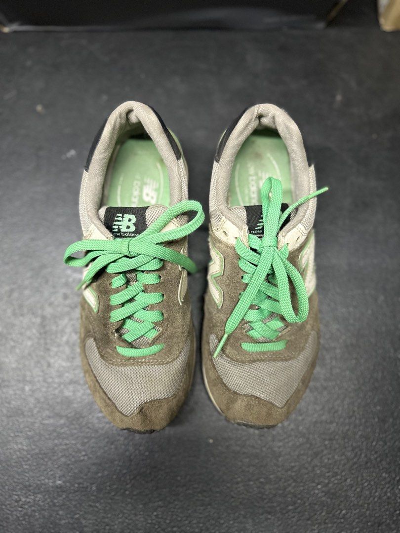New Balance 574 Sneakers (Category: Sneakers) located in Quezon City. Submitted by plzdeclutter (Listing ID 1439218292, Image 3). Description: - New Balance 574 sneakers - Brown and green color scheme - Iconic 'N' logo on the sides - Suede and mesh upper - Green laces - 'New Balance' logo on heel and tongue - No issue -sign of wear -Size 5.