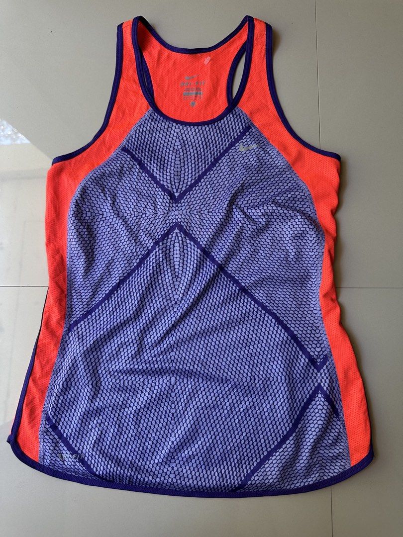Nike Dri-Fit Running Tank Top - Small (Category: Activewear) located in Rosales. Submitted by dariang22 (Listing ID 1439091356, Image 1). Description: - Nike Dri-Fit running tank top - Color: Orange and purple - Size: Small - Racerback design - Made in Malaysia - Material: 100% polyester - Nike logo visible - Ideal for running and athletic activities.