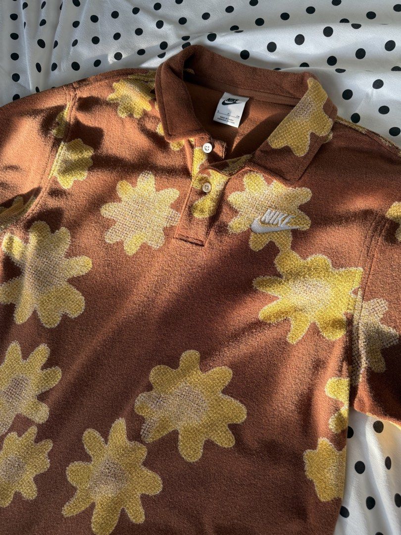 Nike Floral Polo Shirt (Category: Tshirts & Polo Shirts ) located in Quezon City. Submitted by kyudotcom (Listing ID 1439158345, Image 1). Description: - Nike polo shirt - Floral pattern - Brown and yellow color scheme - Collared neckline - Button-down closure - Embroidered Nike logo - Size S.