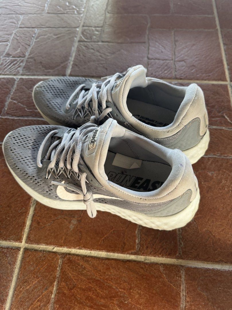 Nike Skyelux Gray Running Shoes (Category: Sneakers) located in San Fernando. Submitted by backyard.sale (Listing ID 1439224159, Image 3). Description: - Gray Nike Skyelux running shoes - Breathable mesh upper - White sole with Nike swoosh - Lace-up closure - "Run Easy" insole - Some wear on soles - Good condition just needs washing.
