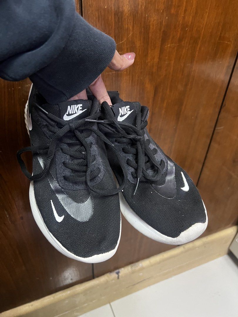 Authentic Nike Women's Sneakers (Category: Sneakers) located in Manila. Submitted by moon_2026 (Listing ID 1439206413, Image 1). Description: - Black Nike sneakers - Size: US 6.5, UK 4, EUR 37, 23.5 cm - White soles and swoosh logos - Black laces - Mesh upper - Made in Vietnam - Minor wear on soles -what you see is what you get.