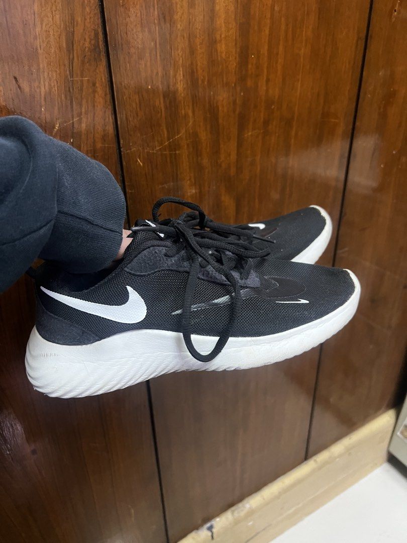 Authentic Nike Women's Sneakers (Category: Sneakers) located in Manila. Submitted by moon_2026 (Listing ID 1439206413, Image 2). Description: - Black Nike sneakers - Size: US 6.5, UK 4, EUR 37, 23.5 cm - White soles and swoosh logos - Black laces - Mesh upper - Made in Vietnam - Minor wear on soles -what you see is what you get.