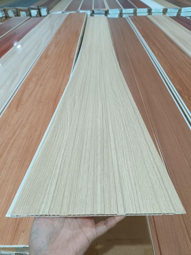 NNN PVC Panel - Wood Grain Design (Category: Construction & Building Materials) located in Manila. Submitted by rowenavale01715 (Listing ID 1439230828, Image 2). Description: - New PVC wood grain panels - Available colors: Light wood, Reddish-brown - Dimensions: 300mm x 2200mm - Perfect for interior walls and ceilings - Easy to install and maintain - Durable and water-resistant.