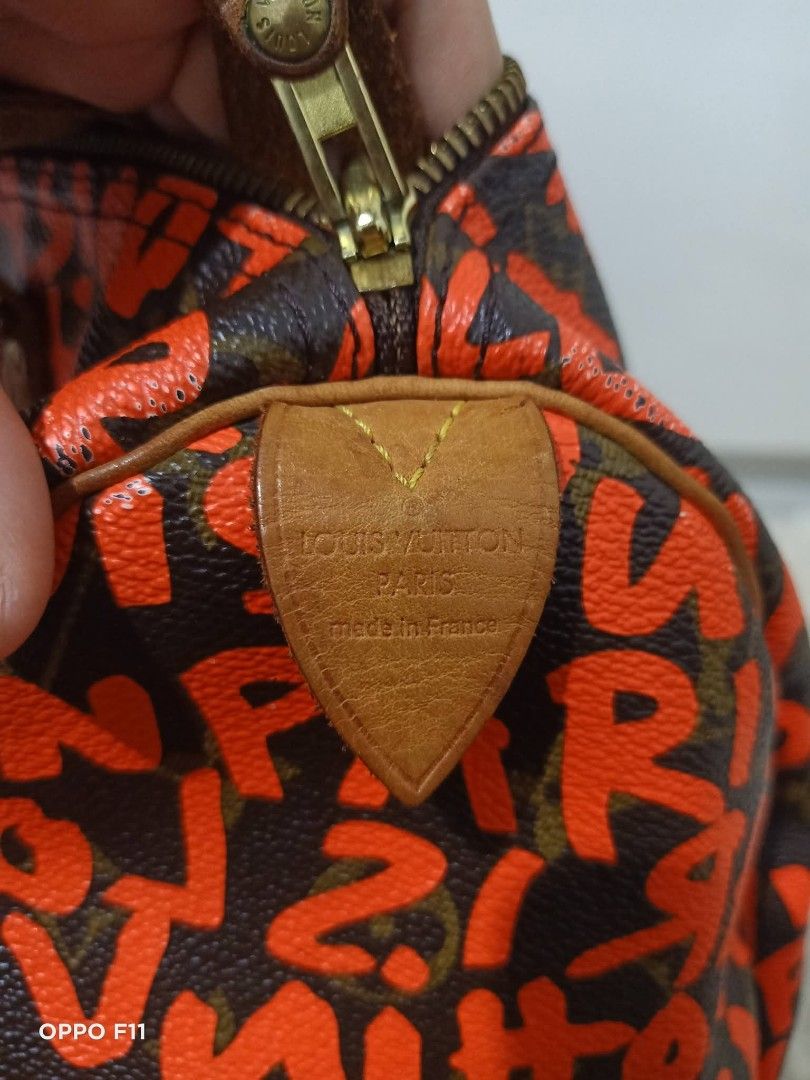Orig lv graffiti speedy30 (Category: Luxury Bags & Wallets) located in Tagum. Submitted by janmarion049706 (Listing ID 1439233893, Image 3). Description: money back guarantee if proven fake with sign of use water marks sa handle may minimal rubs sa ,pipings may faded sa letters good condition with dustbag with lockset Japan item.