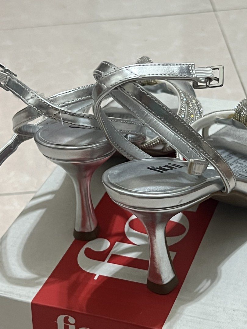 Payless Fioni Silver Heels Sandals (Category: Heels) located in Cavite. Submitted by thingzx (Listing ID 1439146683, Image 2). Description: From Payless. Brand new with box. Just tried them on. Size 6/23cm. Heel height 7cm. Last price posted. Half off na yan, check the sticker tag. Shipping c/o buyer. Can ship nationwide or do same day from Cavite. Payment via Gcash/Maribank/BDO. RFS: Doesn't fit; too small..