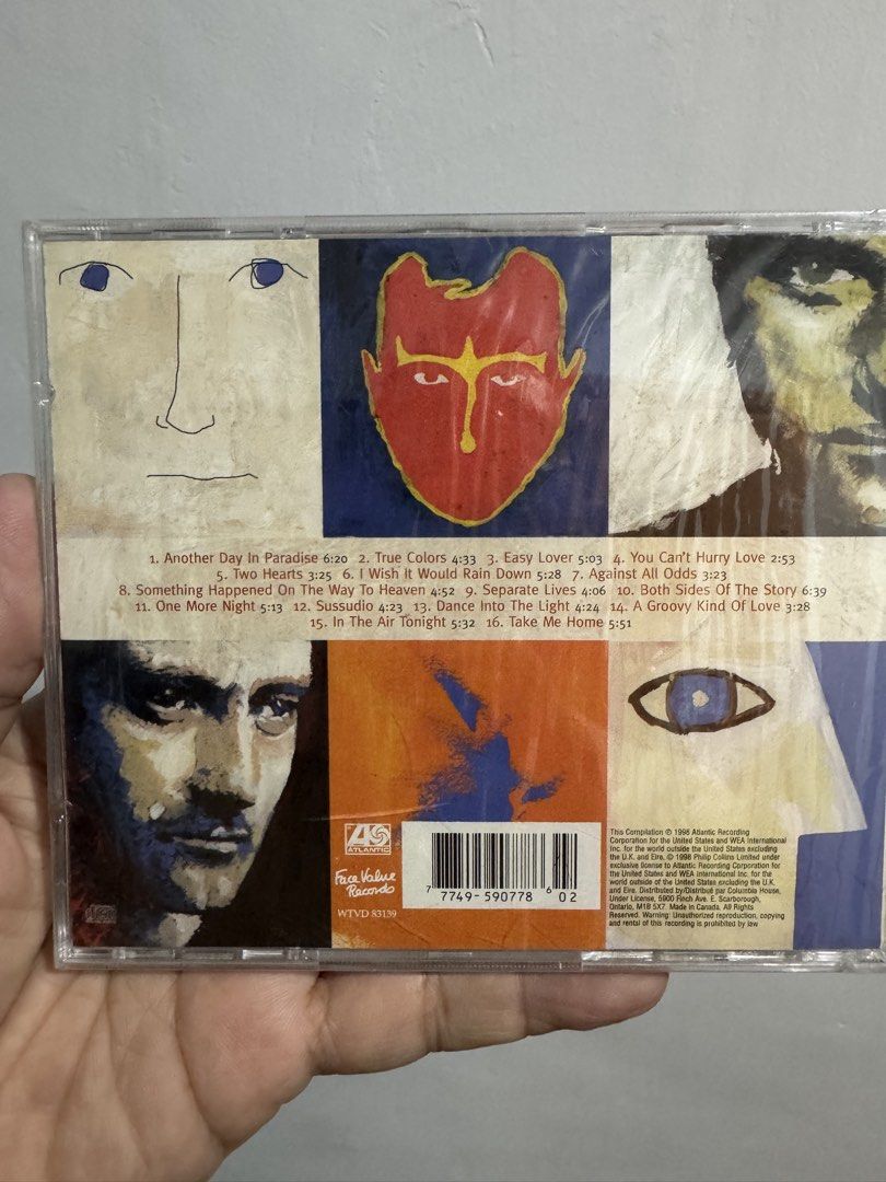 Phil Collins ...Hits CD (Category: CDs & DVDs) located in San Juan City. Submitted by redgecollection (Listing ID 1439185743, Image 2). Description: BRAND NEW SEALED CD - Phil Collins Greatest Hits CD - Features popular tracks like "Another Day in Paradise," "Easy Lover," and "Against All Odds." - Original packaging included. - Tracklist and details on the back of the case. - Perfect for music lovers..