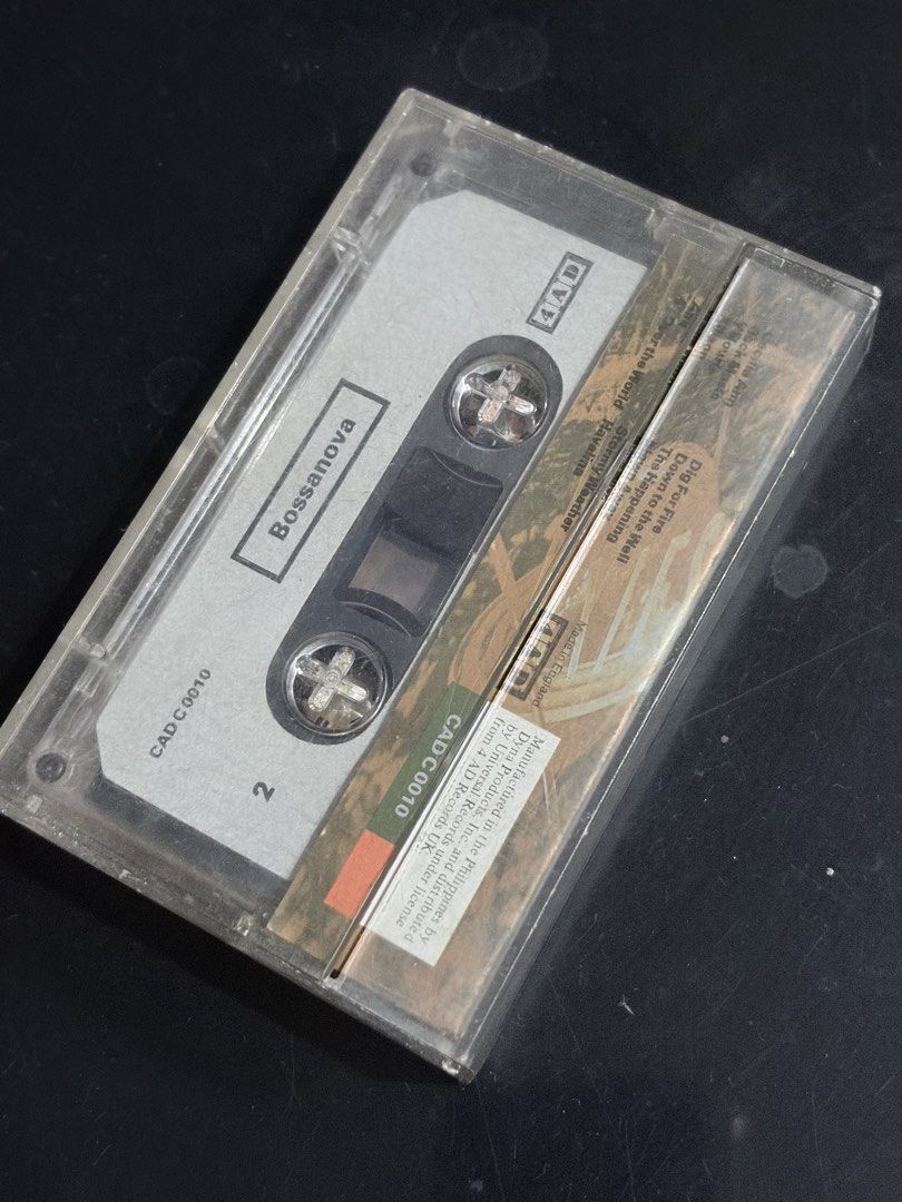 Pixies - Bossanova Cassette Tape (Category: CDs & DVDs) located in Tabaco. Submitted by cinemahilig (Listing ID 1439165661, Image 2). Description: - Original Pixies "Bossanova" cassette tape - Comes in its original case - Album title and band name visible - Case features album artwork - Cassette tape labeled CAD C0010.