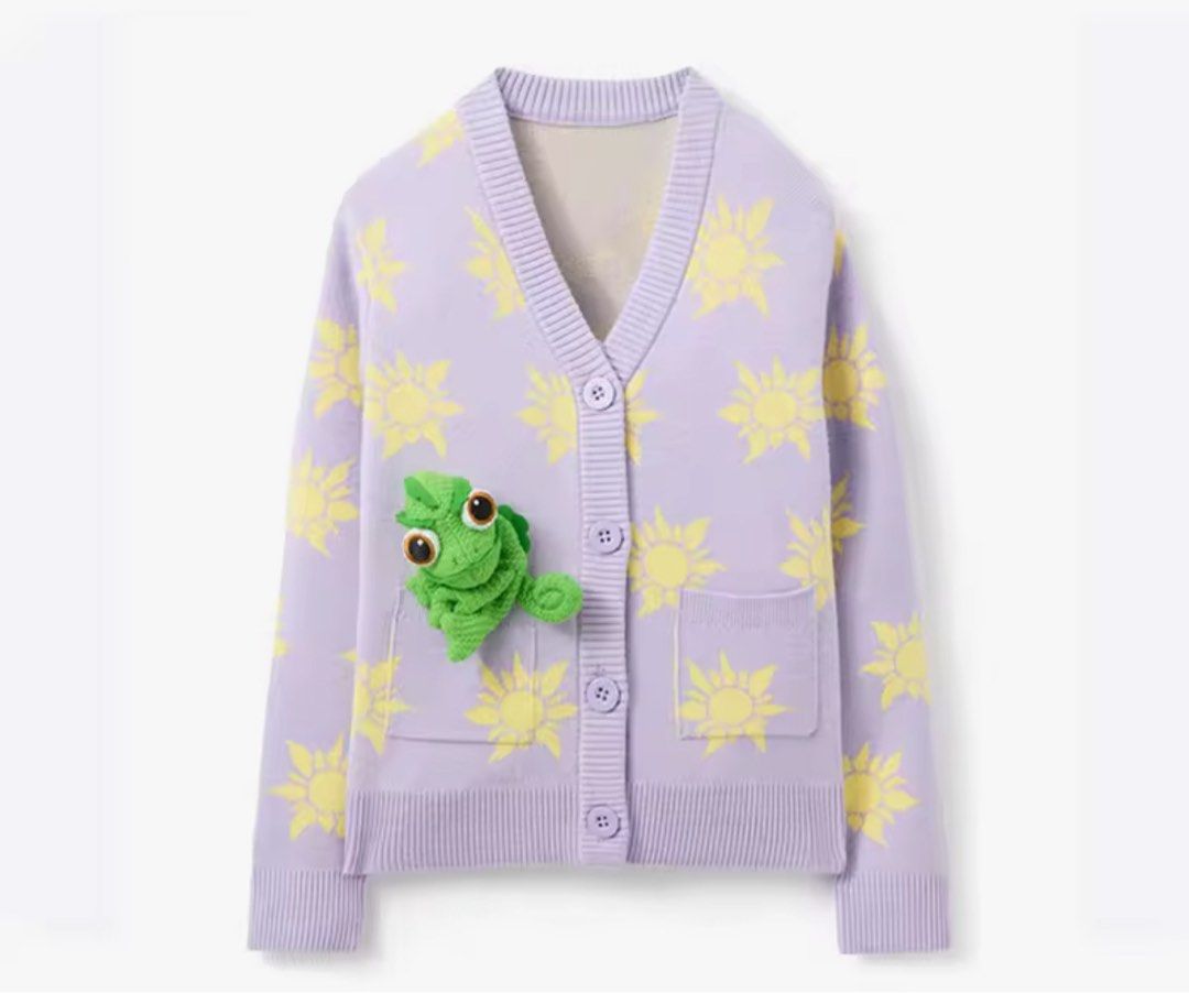 Rapunzel Sun Cardigan with Pascal Disney Tangled (Category: Babies & Kids Fashion) located in Muntinlupa City. Submitted by declutter.by.d (Listing ID 1439120199, Image 1). Description: - Original merch - Light purple cardigan - Yellow sun pattern design - V-neck and button closure - Long sleeves - Two front pockets - Features a green Pascal the chameleon detail .
