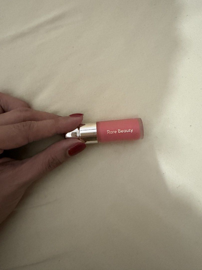 Rare Beauty Soft Pinch Liquid Blush - Charm(Mini) (Category: Makeup) located in Davao. Submitted by fabdeclutter (Listing ID 1439247403, Image 1). Description: - Rare Beauty Soft Pinch Liquid Blush in "Charm" - Liquid formula - Size: 0.11 fl. oz. / 3.2 mL - Color: Soft peachy-pink - Made in China.
