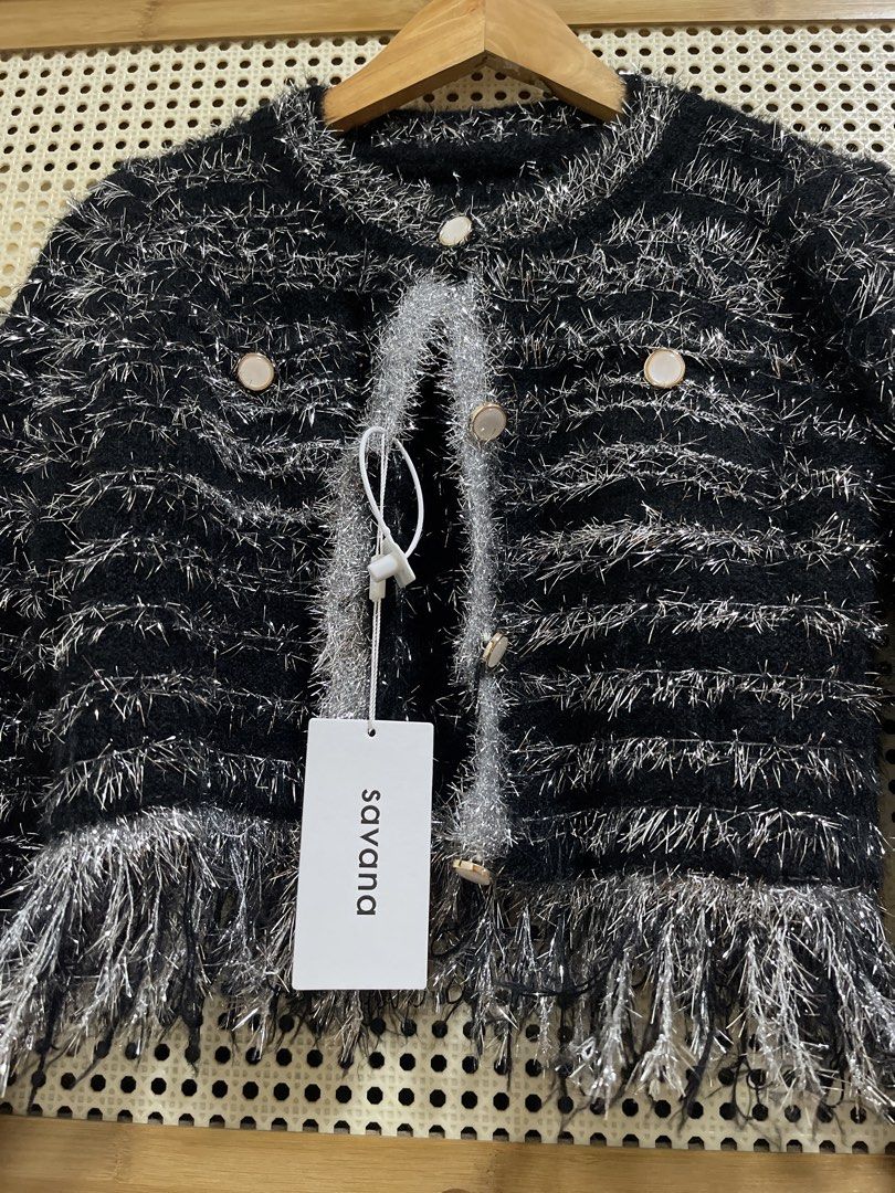 Savana Black and Silver Fringe Jacket (Category: Coats, Jackets and Outerwear) located in Arayat. Submitted by prettyquen (Listing ID 1439114894, Image 1). Description: - Savana jacket - Black and silver textured design - Fringe detailing - Round neckline - Gold-toned button closure - Long sleeves - Cropped length - New with Savana tag.