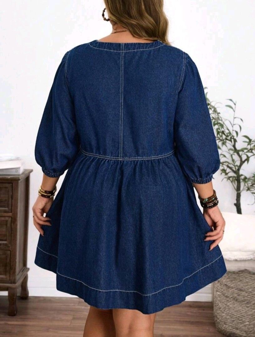 SHEIN Plus Size Denim Midi Dress (Category: Dresses) located in Los Banos. Submitted by jazzandjacob14 (Listing ID 1439157050, Image 2). Description: Navy denim midi dress. Features a square neckline, long sleeves, and flared hem. Button-up front with white stitching. Plus size. 0xl on tag but can fit to 1xl.