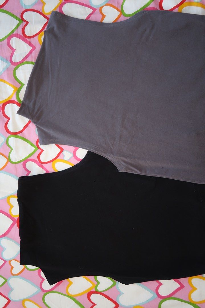 Sleeveless Turtleneck Top - Black and Gray (Category: Sleeveless) located in Paranaque City. Submitted by lovedbycamilla (Listing ID 1439183347, Image 2). Description: - Used less than 10x - Fits S-M - Sleeveless tops - Colors: Black and Gray - 170 Each, 300 Take All - Flattering asymmetrical neckline - Fitted silhouette - Soft, stretchy fabric.