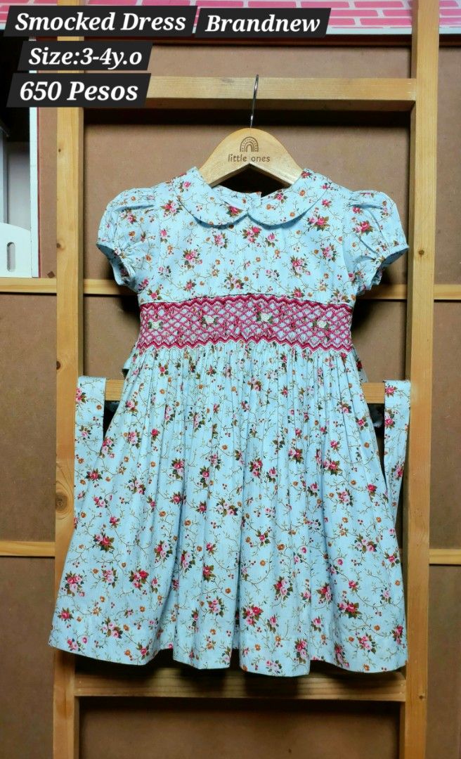 Smocked Dress for Toddlers (Category: Babies & Kids Fashion) located in Caloocan City. Submitted by clairyyyyy (Listing ID 1439133914, Image 2). Description: - Adorable smocked dress for toddlers (3-4 years old). - Features a charming floral pattern. - Classic Peter Pan collar. - Comfortable short sleeves. - Stylish tie-back design. - Perfect for special occasions and everyday wear. - Brand: Juniors.