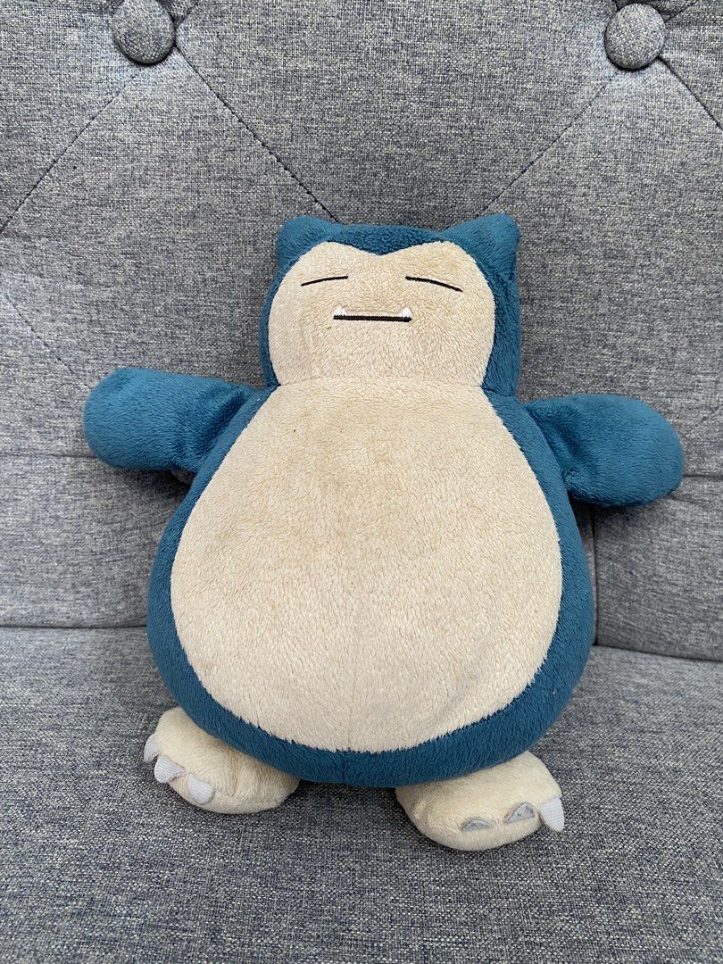 Snorlax Plush Toy OFFICIAL (Category: Plushies & Soft Toys) located in Cavite. Submitted by lymseven (Listing ID 1439130729, Image 1). Description: Bought from Japan Bigger than Palm Size NO TAG Official Tag CUT No Defects Slightly Stained, Not Visible Rough Texture .