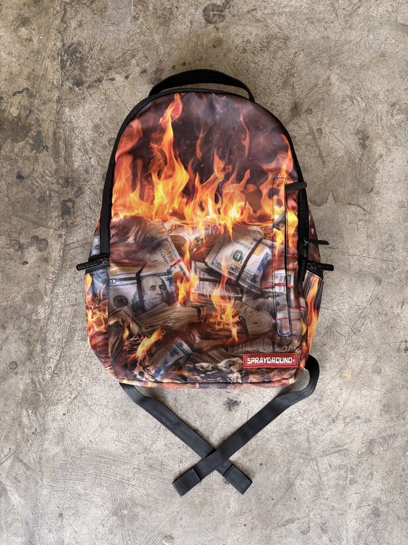 sprayground burning money backpack (Category: Backpacks) located in Manila. Submitted by ykwtfgon (Listing ID 1439088346, Image 1). Description: Sprayground burning money backpack lightly used 10/10 condition 3000php meetups around metromanila if shipping any courier will do .