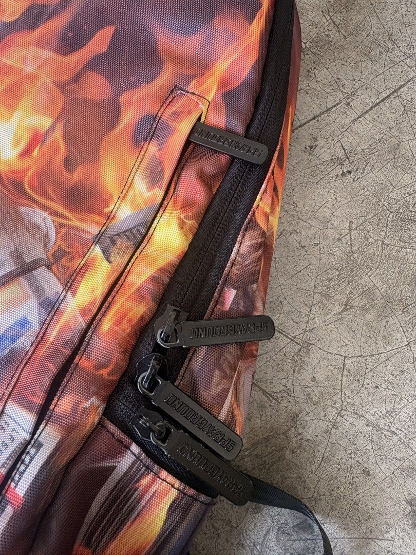 sprayground burning money backpack (Category: Backpacks) located in Manila. Submitted by ykwtfgon (Listing ID 1439088346, Image 3). Description: Sprayground burning money backpack lightly used 10/10 condition 3000php meetups around metromanila if shipping any courier will do .
