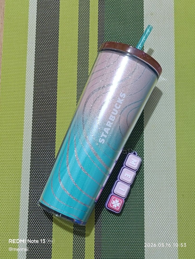 Starbucks Tumbler with Straw (Category: Water Bottles & Tumblers) located in Pasay City. Submitted by meimeichua (Listing ID 1439246035, Image 1). Description: - Starbucks tumbler with a stunning blue and pink gradient design. - Features elegant silver accents. - Includes a matching straw and a stylish lid. - Keeps your drinks cold for hours. - Perfect for any Starbucks enthusiast!.