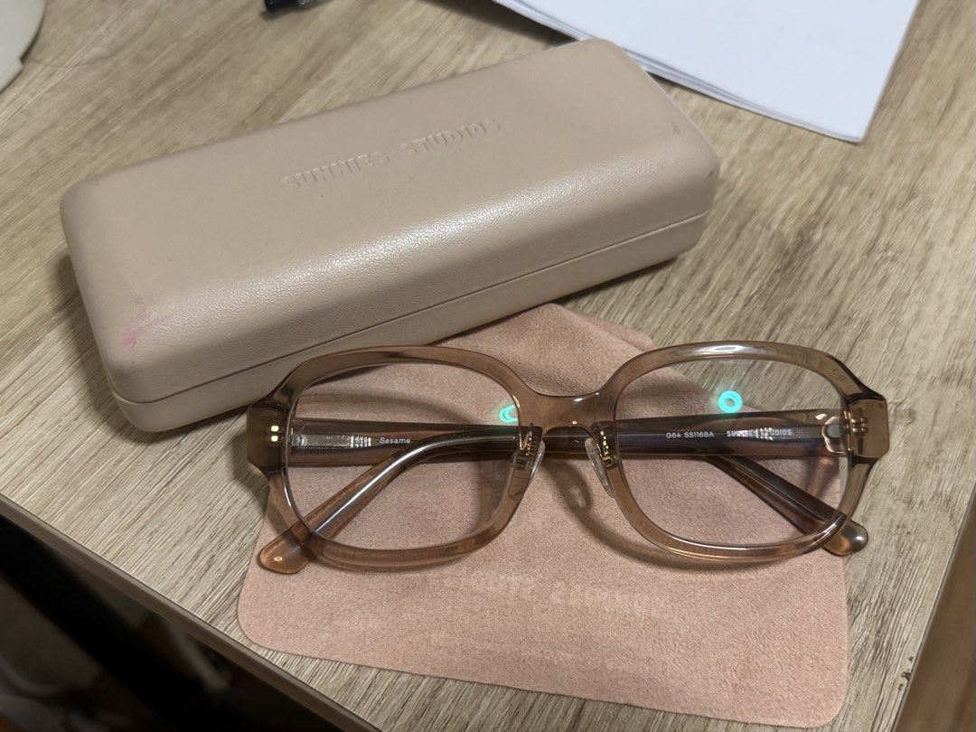 Sunnies Studios Lark Sesame Eyeglasses (Category: Sunglasses & Eyewear) located in Batangas. Submitted by heeybbb (Listing ID 1439180538, Image 1). Description: - Sunnies Studios Lark eyeglasses in Sesame - Includes original case and soft pouch - Frame size: 52/17/145 - Light brown frame - Light beige case - with grade & anti rad adaptive - photochromic lens - barely used .
