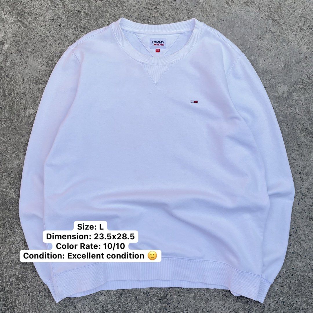 Tommy Jeans White Sweatshirt - Size L (Category: Coats, Jackets and Outerwear) located in Mandaue City. Submitted by chinsyap_03 (Listing ID 1439163522, Image 1). Description: - Tommy Jeans sweatshirt - Size: L - Features Tommy Jeans logo on chest - Brand name on collar - Crew neck - Long sleeves - Color rating: 10/10 - Dimensions: 23.5x28.5.