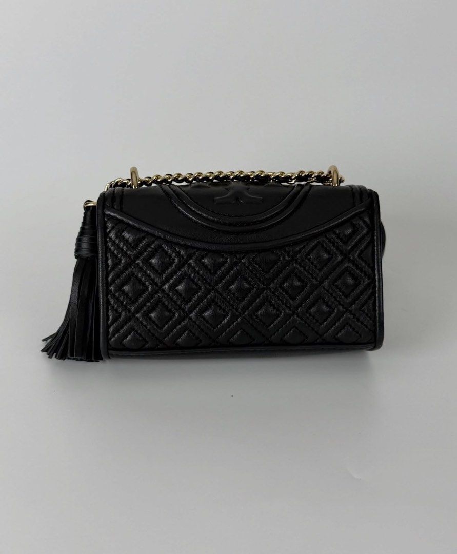 Tory Burch Fleming Mini crossbody chain sling flap bag (Category: Luxury Bags & Wallets) located in Manila. Submitted by karminareyes123 (Listing ID 1439236877, Image 2). Description: - I got it from luxebaghaven on ig (they sell legit luxury bags) -Tory Burch Kira Chevron Small Crossbody Bag - Elegant diamond-quilted pattern - Features a convenient chain strap - Includes a stylish tassel detail - Compact size, ideal for daily essentials - Flap c