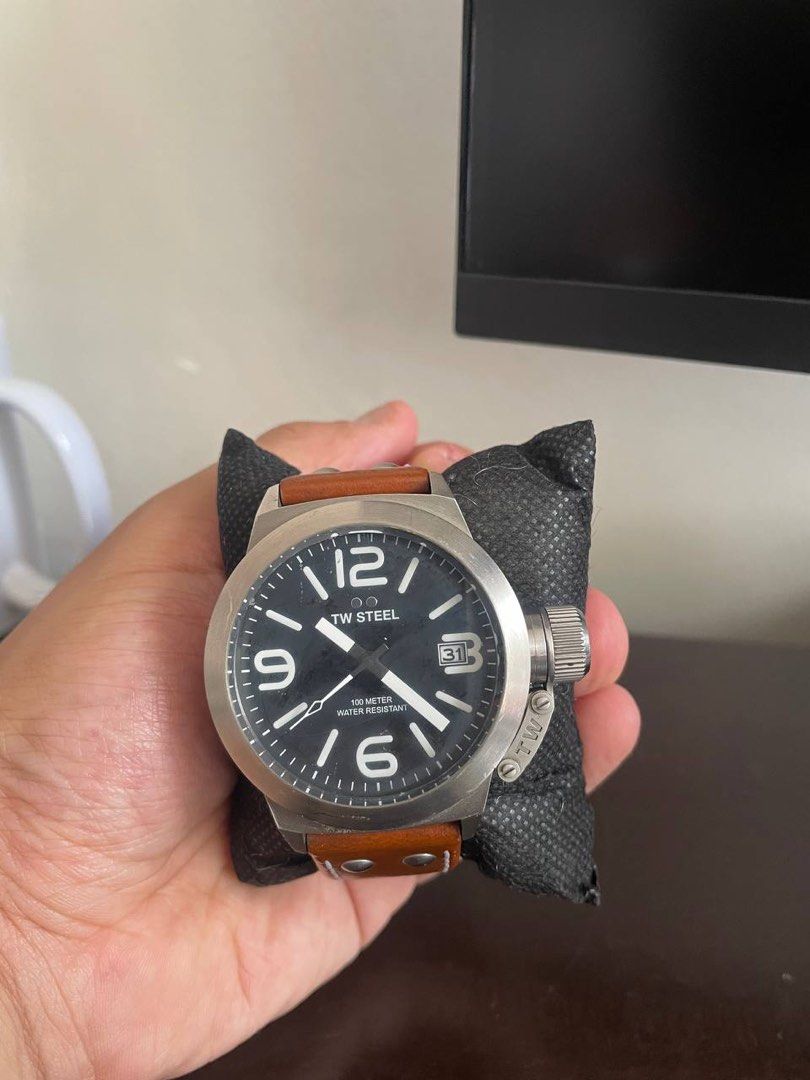 TW Steel Watch (Category: Men's Watches) located in Manila. Submitted by fajardough (Listing ID 1439148462, Image 2). Description: - TW Steel watch - Black dial with large numerals - Date display - Brown leather strap - Stainless steel case - Water-resistant to 100 meters - Crown on the side - Displayed on a black cushion TW Steel Canteen Watch (Brown Leather/Black Dial) - Watch Only Price: ₱3,800 Item Details: Watch only (no box or papers). Orig