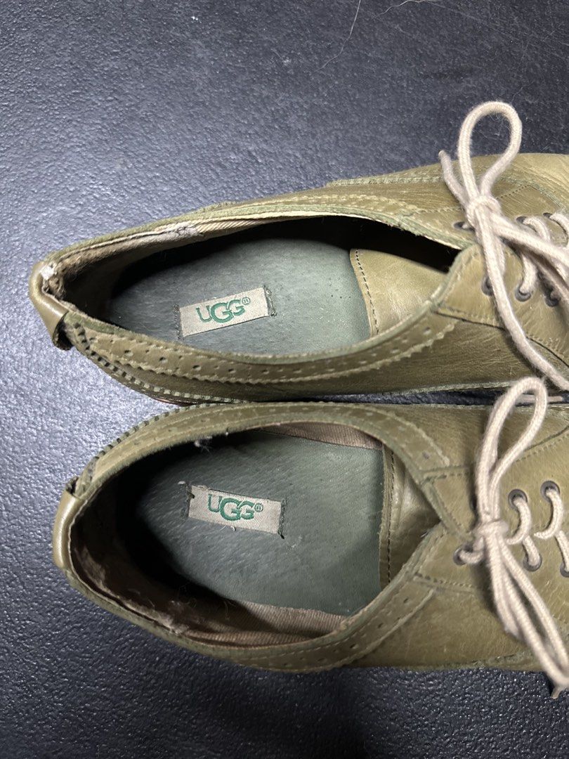 UGG Oxford Shoes - Green (Category: Loafers) located in Quezon City. Submitted by plzdeclutter (Listing ID 1439216547, Image 3). Description: These UGG Oxford shoes feature a classic design with a green leather upper. They have a lace-up closure and a perforated toe cap. The soles show some wear, and the UGG logo is visible on the insole and sole. The shoes appear to be well-maintained and ready for wear..