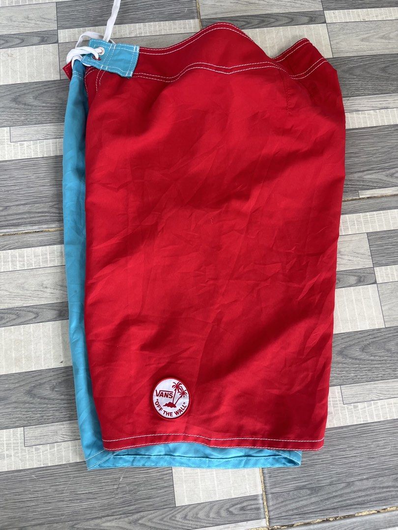 Vans Off The Wall Board Shorts (Category: Shorts) located in Sultan Kudarat. Submitted by c_jay28 (Listing ID 1439113278, Image 3). Description: - Vans board shorts - Blue and red color block design - Drawstring closure - Small pocket on left leg - Vans logo on waistband and patch - Comfortable fit - Perfect for beach or casual wear - size 32.