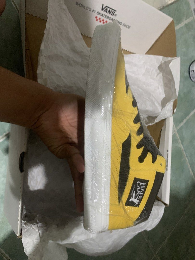 Vans Skate Half Cab Bruce Lee Black/Yellow (Category: Sneakers) located in Manila. Submitted by justthink.61525 (Listing ID 1439084557, Image 3). Description: Vans Skate Half Cab in Bruce Lee Black/Yellow colorway. The shoes are new and come with the original box. The size is US 10, UK 9, EUR 43, and 28cm. The box has a checkerboard pattern. The shoes are yellow and black..