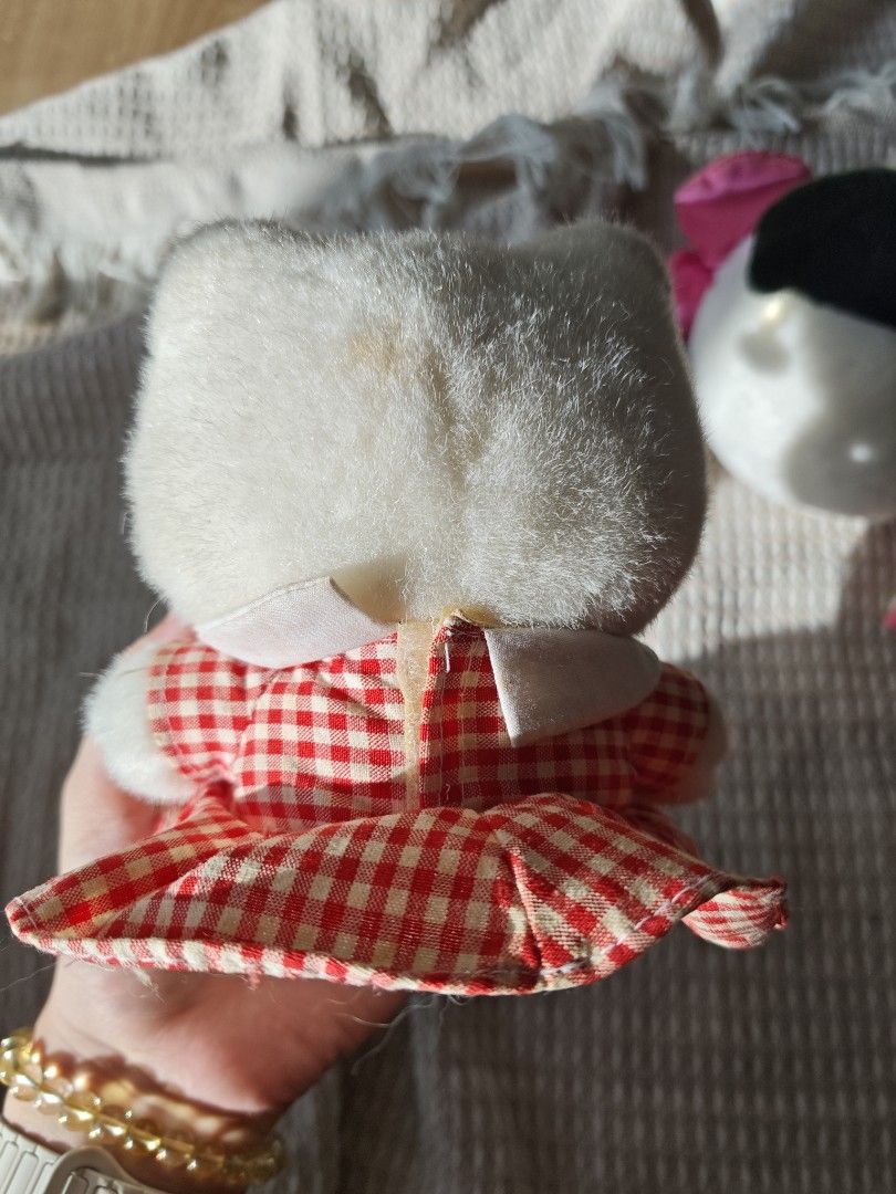 Vintage Sanrio Hello Kitty Plush Toy (Category: Toys & Games) located in Caloocan City. Submitted by luckyrabbit-d68b (Listing ID 1439152730, Image 2). Description: - Adorable vintage Hello Kitty plush toy. - Classic white body. - Red and white checkered dress. - Pink bow. - Yellow nose and black eyes. - Includes original Sanrio tag. - Perfect for collectors!.
