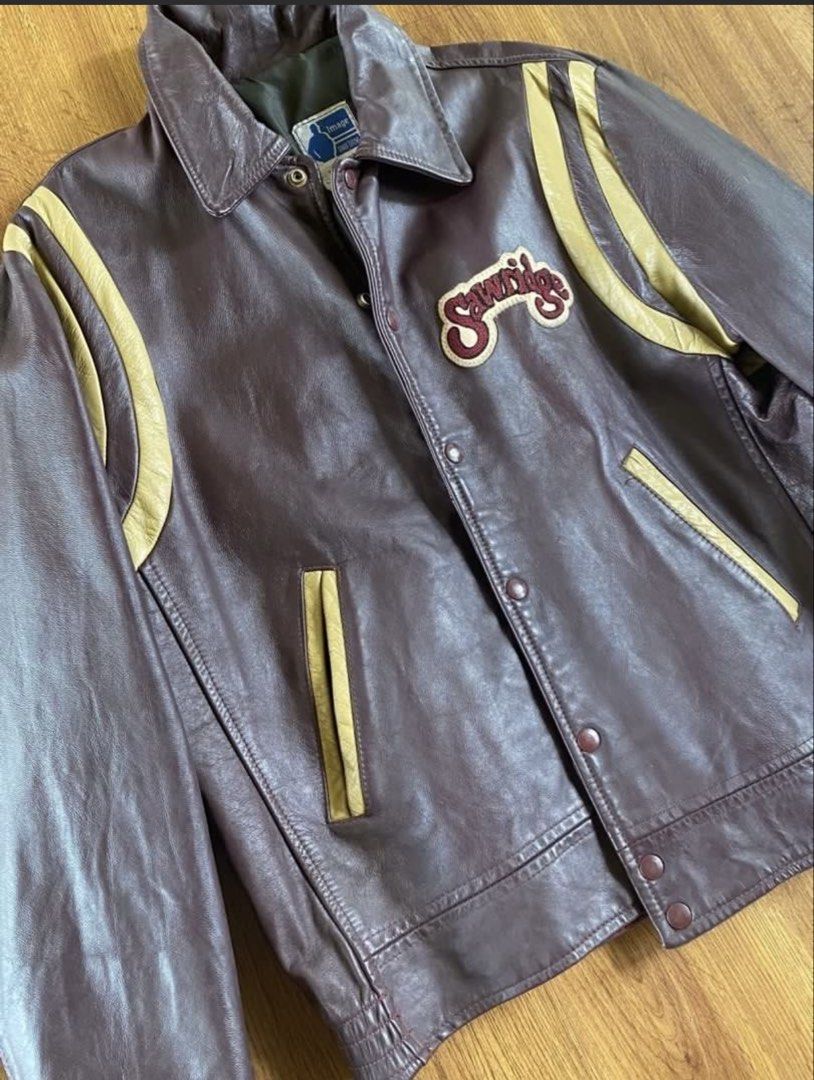 Vintage Y2K Varsity Sawridge Leather Jacket (Category: Coats, Jackets and Outerwear) located in Quezon City. Submitted by thrift.tingz (Listing ID 1439139221, Image 2). Description: - Vintage leather jacket from Image Uniform - Brown leather exterior - Beige stripes and "Sawridge" patch - Button-up front - Collar - Size: 44T - Made in Edmonton, Alberta - Dimensions: length - 26 arms - 25 shoulders - 19 chest - 22.
