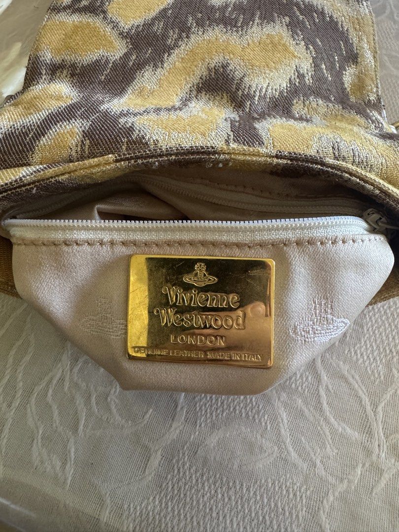 Vivienne Westwood Shoulder Bag (Category: Luxury Bags & Wallets) located in Roxas City. Submitted by authentic_bags357 (Listing ID 1439137210, Image 3). Description: Genuine Leather Made in Italy Flaws: Visible wear and cracking of straps Negotiable price.