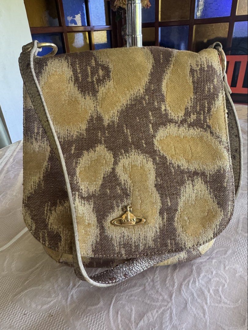 Vivienne Westwood Shoulder Bag (Category: Luxury Bags & Wallets) located in Roxas City. Submitted by authentic_bags357 (Listing ID 1439137210, Image 1). Description: Genuine Leather Made in Italy Flaws: Visible wear and cracking of straps Negotiable price.