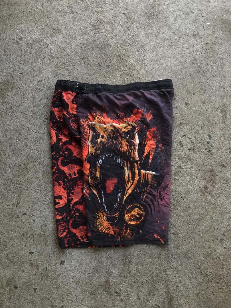 VNTAGE 2000s' JURASSIC WORLD T'REX Graphics Board Short! (Category: Shorts) located in Pulupandan. Submitted by 89archives (Listing ID 1439182311, Image 3). Description: WAIST' 31 Fire Design🔥🔥🤩 LENGTH' 21 THIGHTS' 12 LEG HOLE' 10.5 Condition Excellent/Good Color rate 9/10 Issue-NONE Need Wash Only!!.