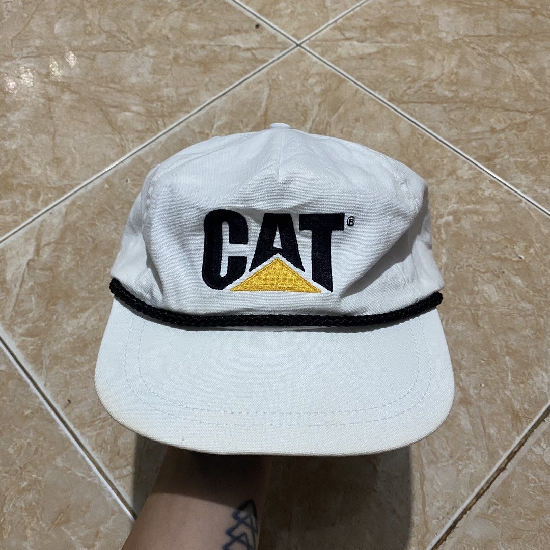 Vntg Caterpillar (Category: Caps & Hats) located in Manila. Submitted by killthismane (Listing ID 1439211484, Image 2). Description: Vintage Caterpillar white trucker hat featuring a black rope detail, embroidered logo and white strap back..