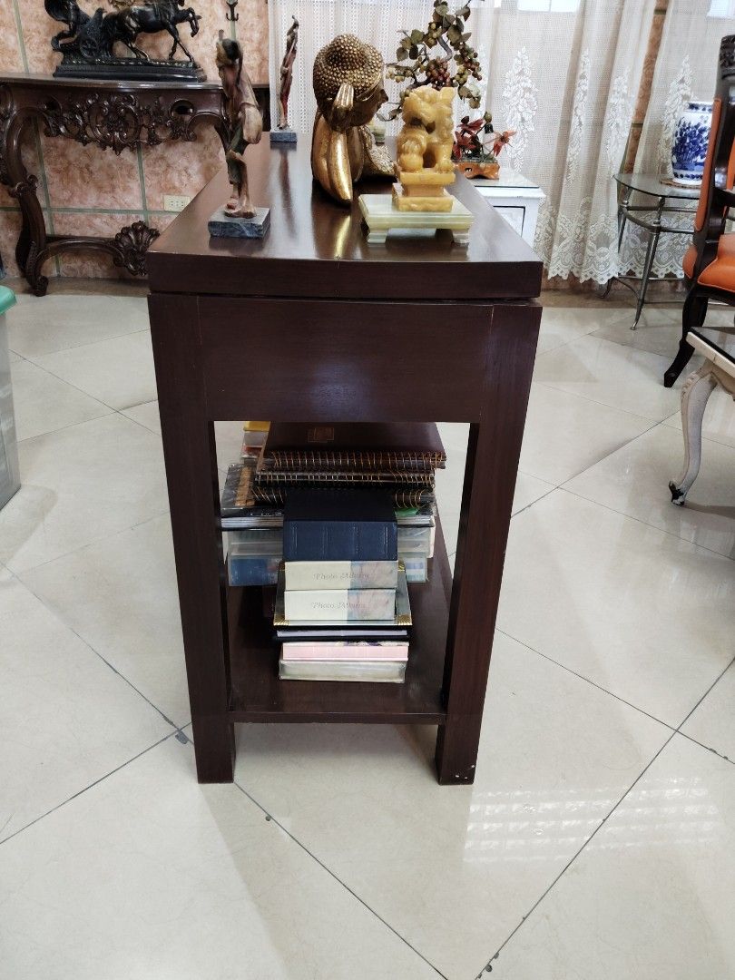 Wooden Console Table with Drawers (Category: Tables & Sets) located in Quezon City. Submitted by joemag_corp_owl (Listing ID 1439072405, Image 3). Description: - Wooden console table - Three drawers for storage - Lower shelf for additional storage - Rich, dark brown finish ADDRESS: 160 N. DOMINGO ST. COR. AURORA BLVD CUBAO QUEZON CITY CP#: 09178821037.