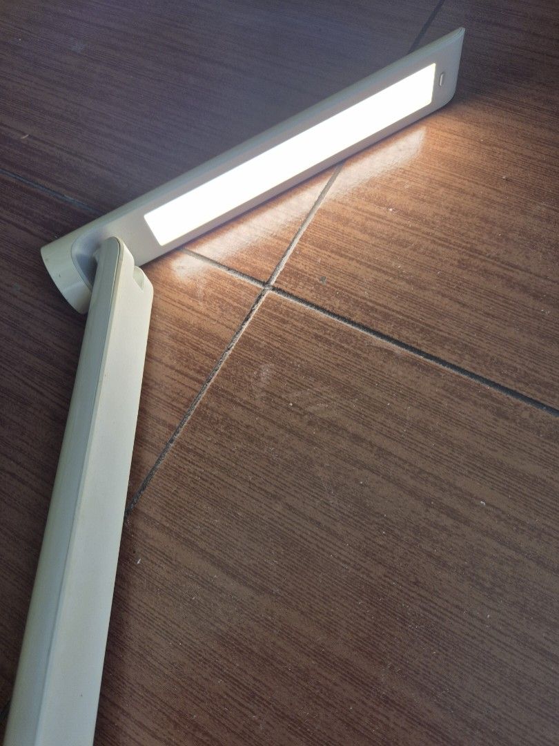 Yeelight LED Rechargeable Folding Desk Lamp (Category: Lighting) located in Makati City. Submitted by zotag (Listing ID 1438304407, Image 1). Description: - Rechargeable and foldable Yeelight LED desk lamp. - Sleek white body with a circular base. - Adjustable arm for flexible light direction. - Base includes model number (YLTD1101), serial number - Convenient button on the lamp head for easy operation..