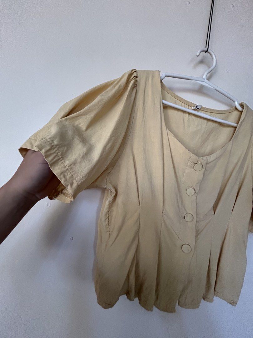Yellow Button-Up Top (Category: Blouses) located in Miagao. Submitted by mjhandpicked (Listing ID 1439180010, Image 3). Description: Length: 17.5in Width: 16in Condition: 9/10 Simple lang pero comfy and cute💛 square neckline and short, puffed sleeves; button-up front, peplum hem Rfs: decluttering .