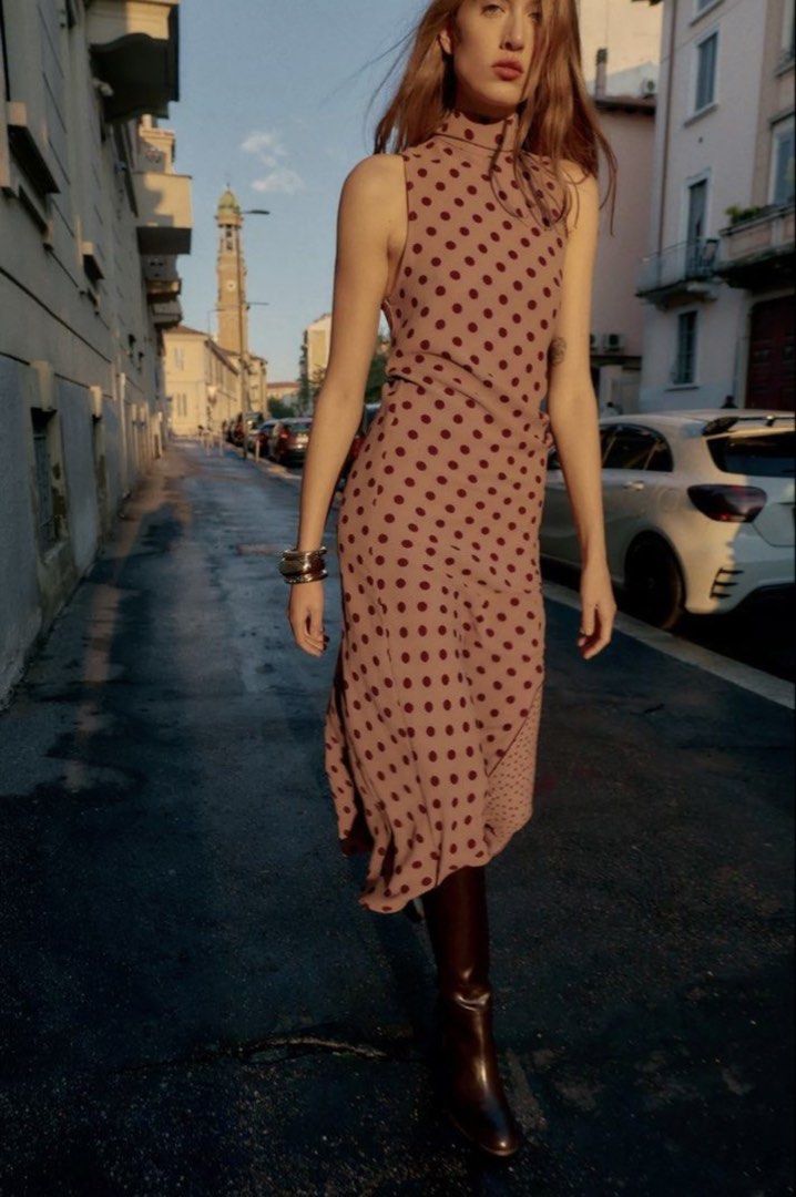 Zara Polka Dot Dress (Category: Dresses) located in Makati City. Submitted by bibas.corner (Listing ID 1439235112, Image 1). Description: - Zara dress - Polka dot pattern - Size: XS - Color: Brown and dark brown - High neckline - Flowing silhouette - Perfect for various occasions.
