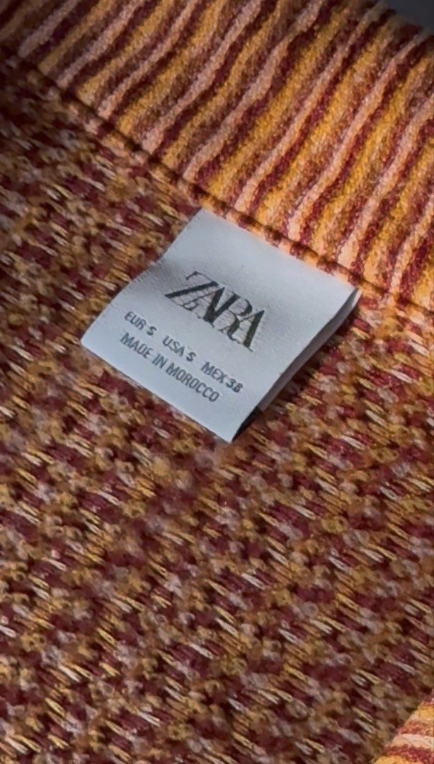 Zara Striped Shirt - Size S (Category: Tshirts & Polo Shirts ) located in Quezon City. Submitted by kyudotcom (Listing ID 1439150416, Image 3). Description: - Zara striped shirt - Size: S but very oversized - Features: Collared neckline, button-down closure - Made in Morocco - knitted fabric - Warm bright color palette.