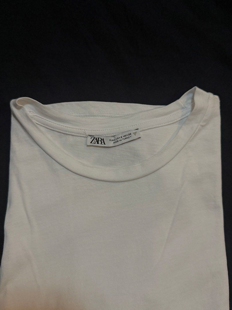 Zara White Ruched T-shirt (Category: Shirts) located in Masbate. Submitted by anjcbr (Listing ID 1439229836, Image 2). Description: - Zara white t-shirt - Ruched detailing on sides - Round neckline - Short sleeves - Bought for ₱695 or ₱795 - Washed and stored only, unused - Slight color variations on the photo due to lighting.